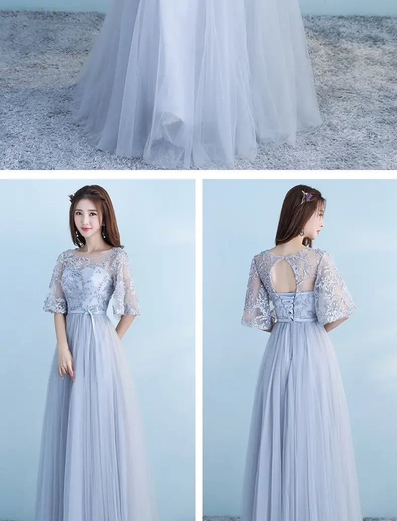 A delicate light blue long bridesmaid blue lace and tulle dress with sheer three-quarter sleeves and a flowing skirt for blue wedding dress occasions.