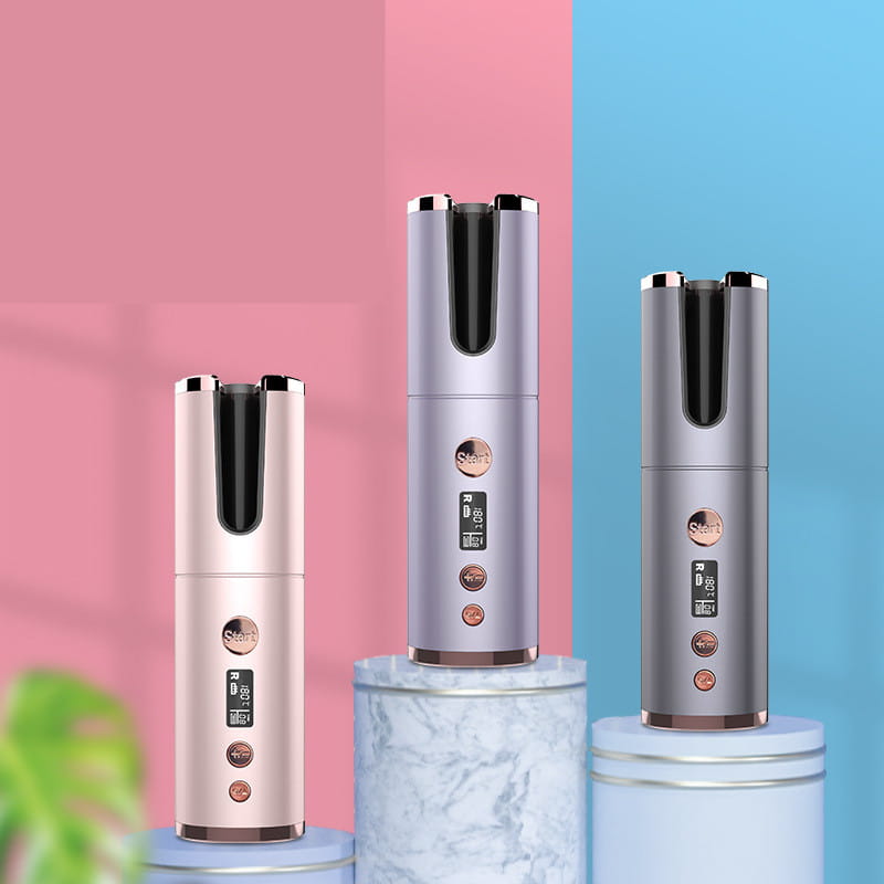 three sleek wireless rechargeable curling irons in rose gold silver and gunmetal finishes featuring cylindrical design digital displays and control buttons
