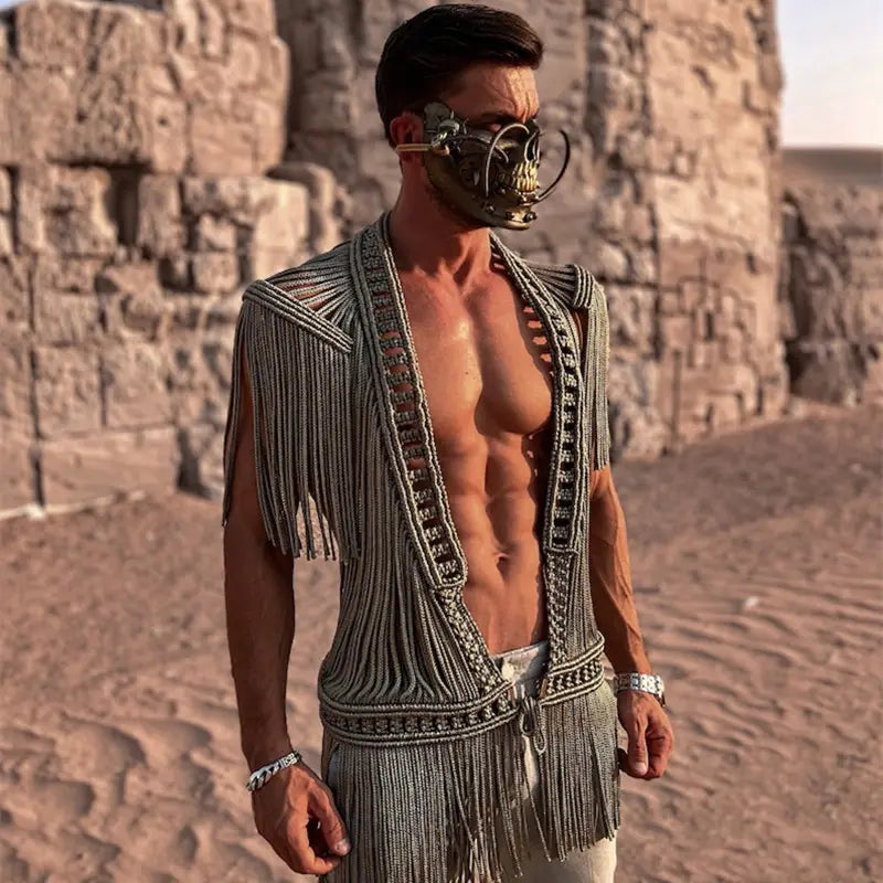 a metallic intricately beaded and fringed vest with a skull motif mask paired with a beige macramé tassel dress creative beach travel set
