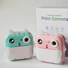 two adorable compact polaroid children’s cartoon cameras in mint green and white and pink and white with rabbit 32g high-speed printing and cute cartoon faces featuring round eyes and smiling mouths