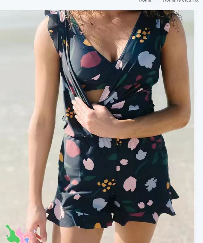 teal ruffled deep v one-piece swimsuit with built-in bra featuring a navy blue floral print with abstract pink white yellow and green blooms suitable for bra hot spring and hot spring boxer use.