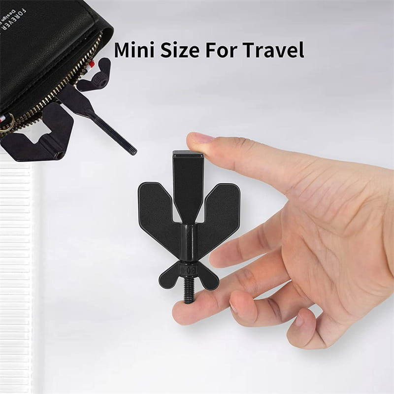 Black plastic travel wallet clip with screw mechanism and wing-like design for portable door lock stopper use.