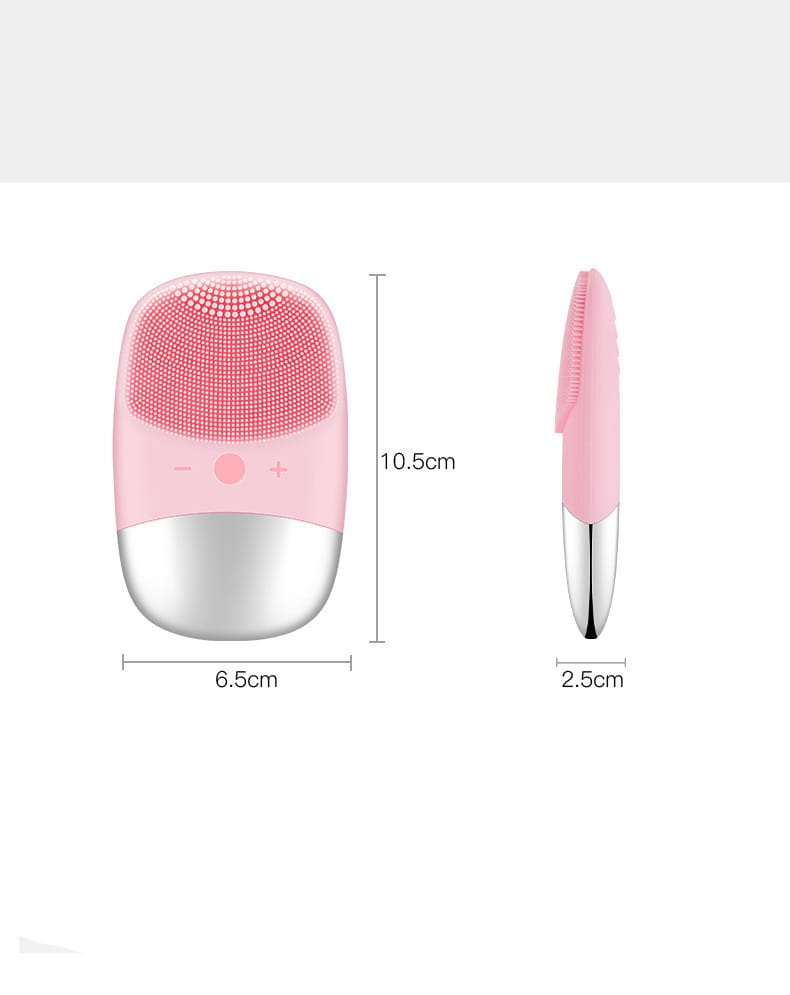 Mini silicone electric facial cleanser brush in pink and silver with soft silicone bristles for gentle cleansing.