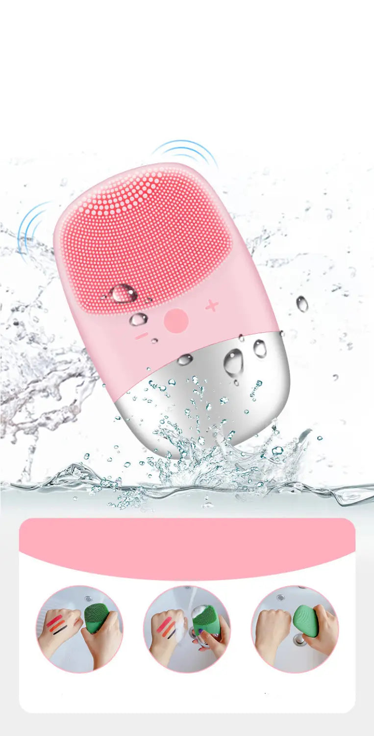 Mini silicone electric facial cleanser brush in pink and silver with soft silicone bristles for gentle cleansing.