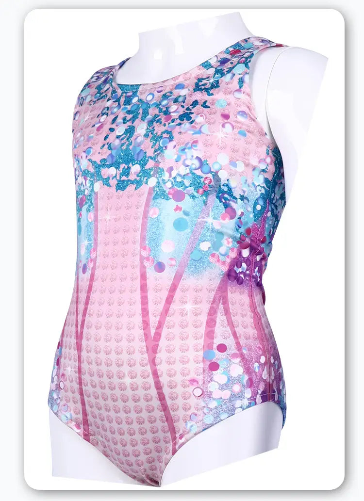 A vibrant pink and blue sequined luxury women’s fashion bikini swimsuit with a geometric pattern displayed on a mannequin.