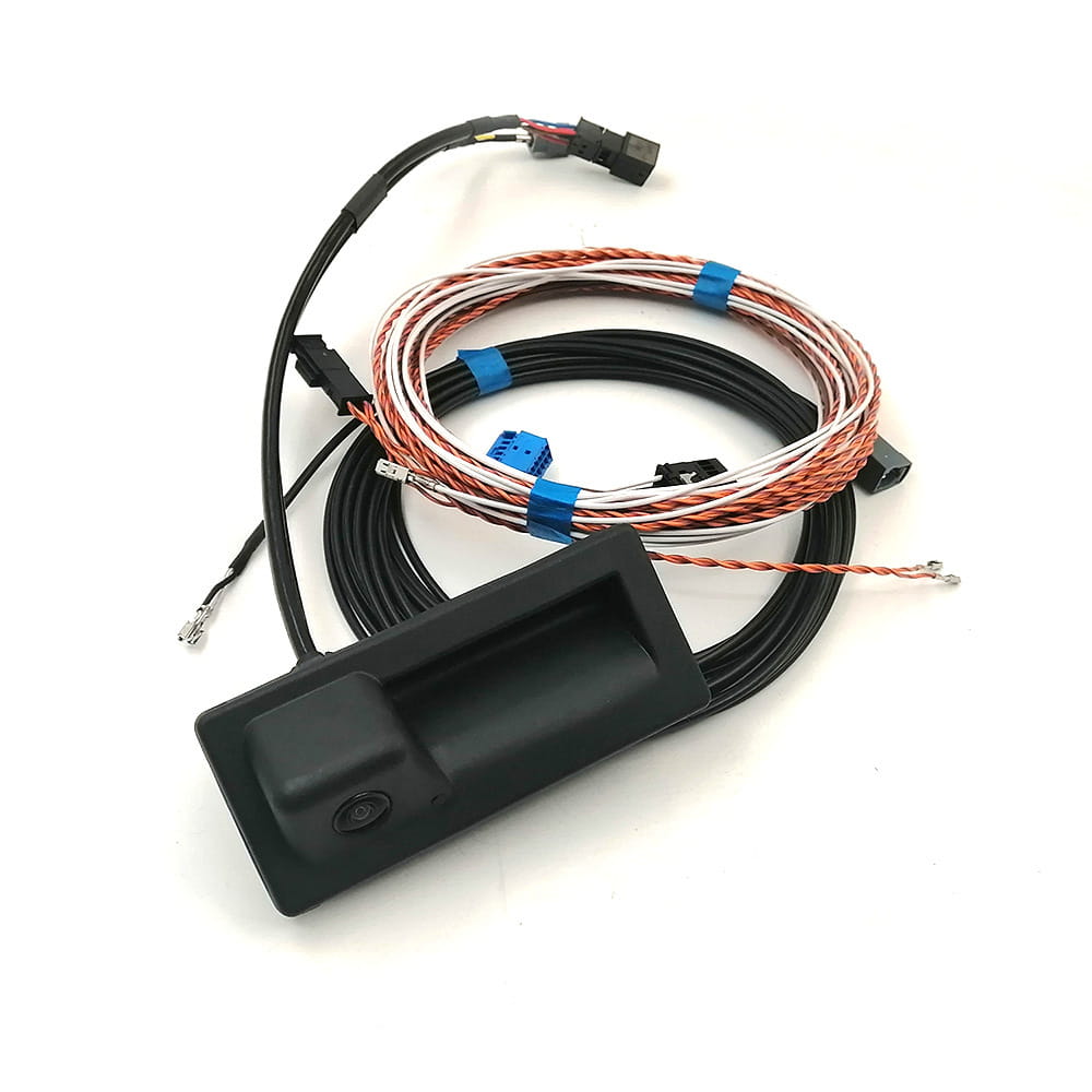 black plastic avant reverse camera with integrated lens and attached wiring harness for Audi A4 S4 Avant reverse camera handle camera shown from the back side