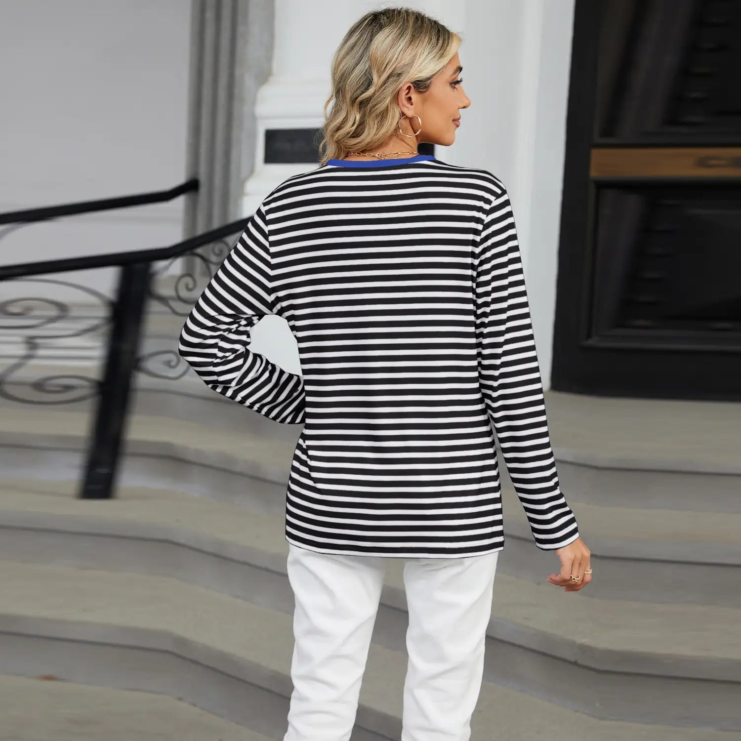 women’s v-neck striped loose henley top featuring black and white horizontal stripes with a blue collar and long sleeves