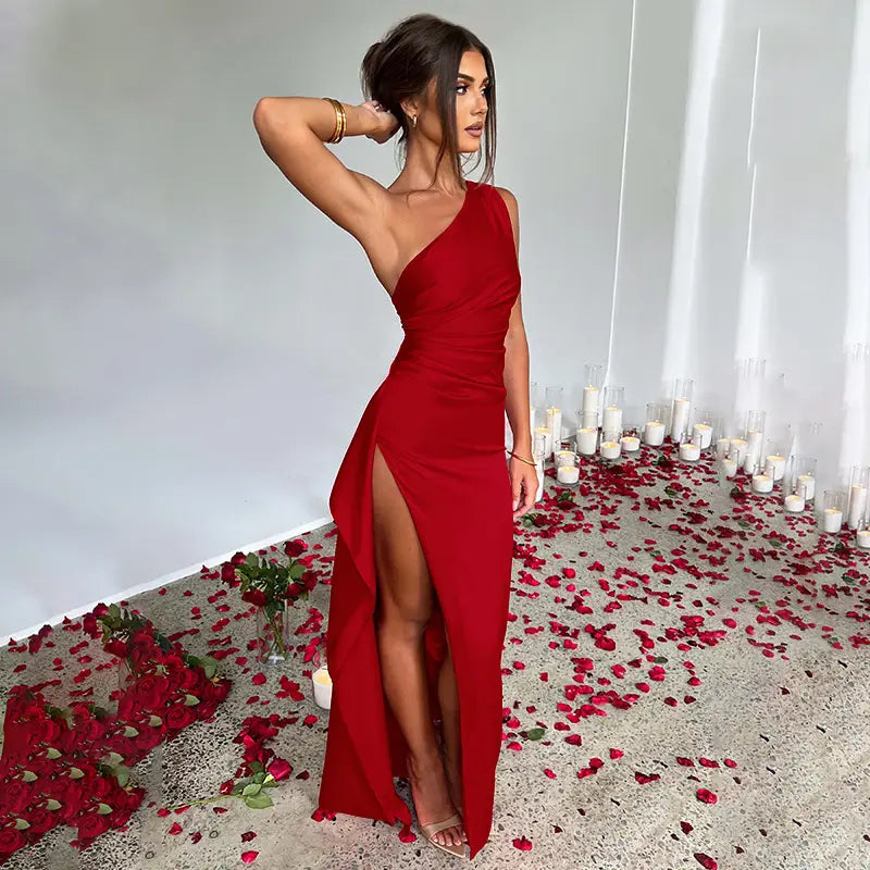 a striking red one-shoulder backless slit gown in satin with a sleek, form-fitting silhouette and high slit providing a sexy one-shoulder backless slit look