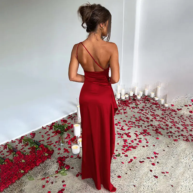 beige one-shoulder backless slit satin gown featuring a flowing deep red satin maxi dress design with backless and thin shoulder straps showcasing a sexy one-shoulder backless slit style