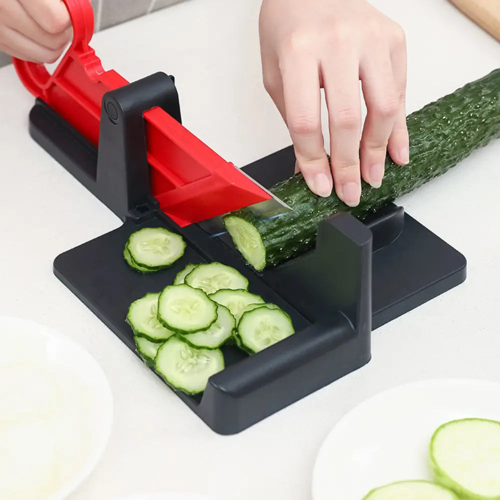 Multifunctional vegetable cutting meat slicer in red and black with a sharp blade for even vegetable cutting in the kitchen.