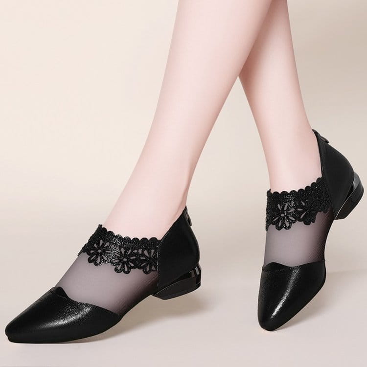 Black lace-accented mesh women’s sandals tide with glossy leather toe and heel in black.