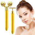 Gold facial roller with faceted diamond-like spheres and sleek metallic handle in 24k gold face roller skin care massager kit