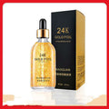 A transparent glass bottle of 24k gold pure hyaluronic acid essence serum with black dropper and gold foil accents by biaoquan