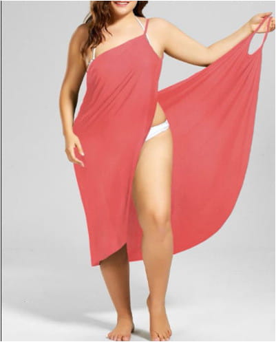 plus size suspenders beach skirt in coral lightweight fabric with thin spaghetti straps and a high slit ideal as a beach cover up