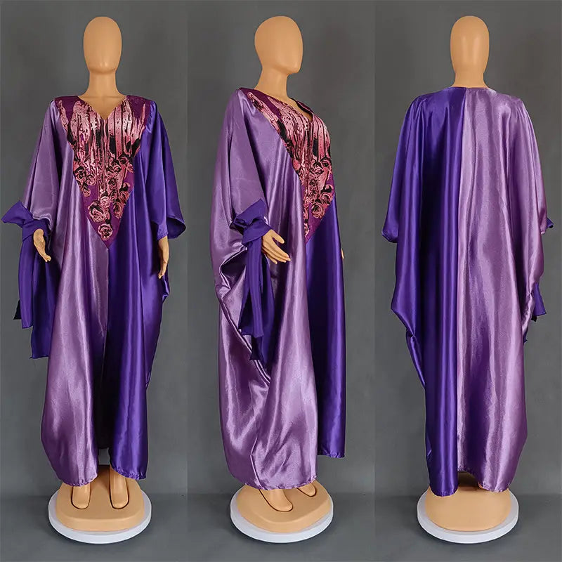 Purple satin abaya ethnic style loose plus size dress with intricate pink and black embroidered detailing on the front.