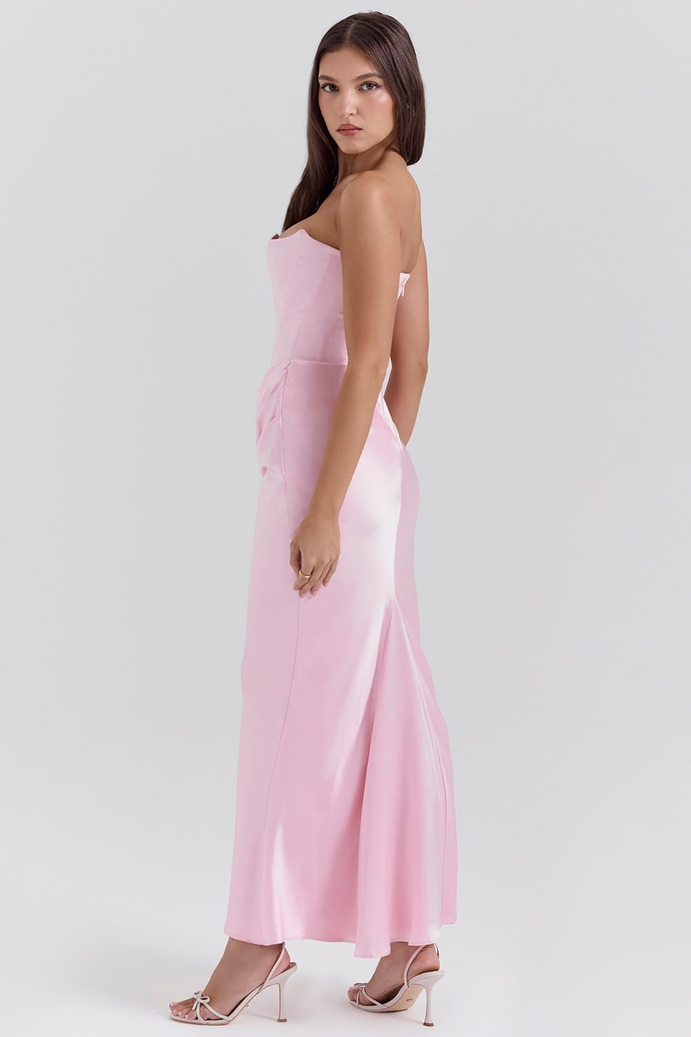 A soft pink satin strapless long dress sexy featuring a fitted bodice and flowing skirt ideal for dress sexy fashion and sexy fashion bandeau occasions.