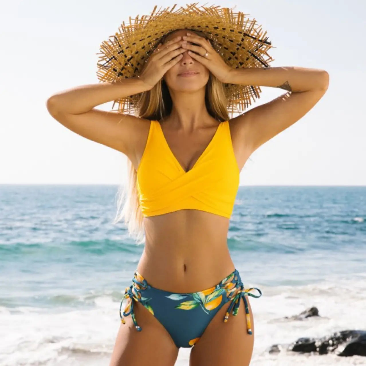 bright yellow and teal tropical print yellow bikini swimsuit with side ties featuring a citrus print design