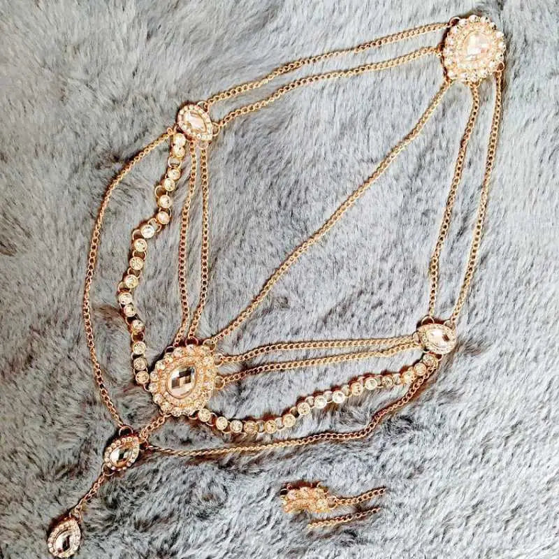 Gold-toned ornate ethnic purple crystal style headwear hair accessories featuring multiple layered chains embellished with sparkling rhinestones and decorative oval medallions.