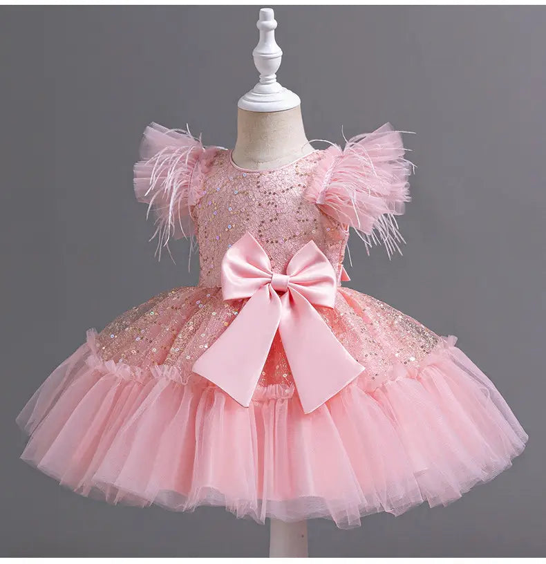 pink sequined toddler dress with feathered sleeves and a large satin bow at the waist ideal for wedding dress tulle or dress tulle skirt summer occasions
