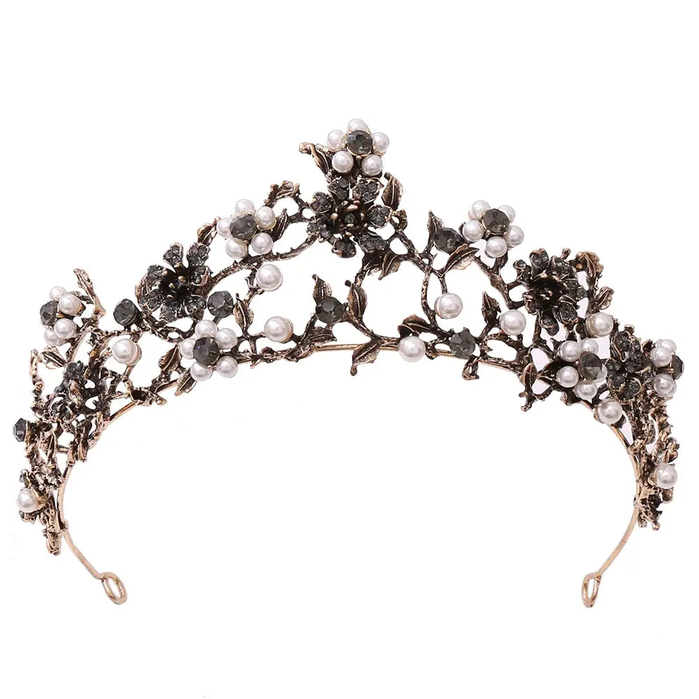 An ornate floral black diamond pearl baroque bridal crown featuring intricate metalwork with dark gemstones and white pearls.