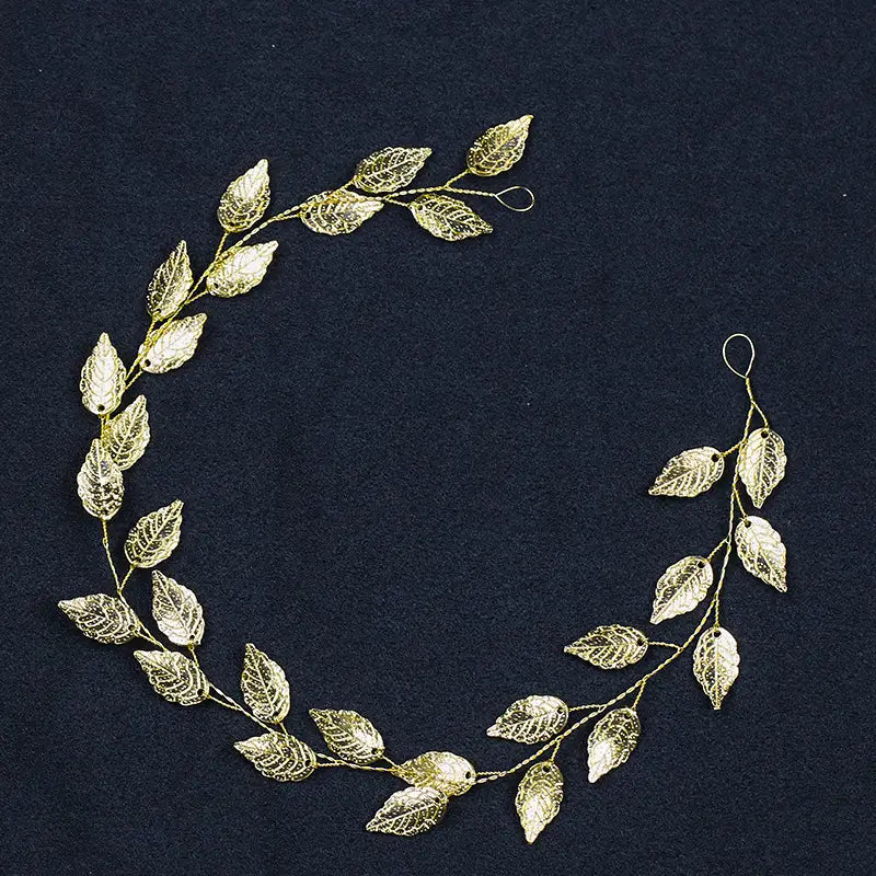 gold and silver leaf hair band featuring a golden leafy headpiece with intricate filigree detailing and delicate wire branches for elegant silver leaf hair styling.