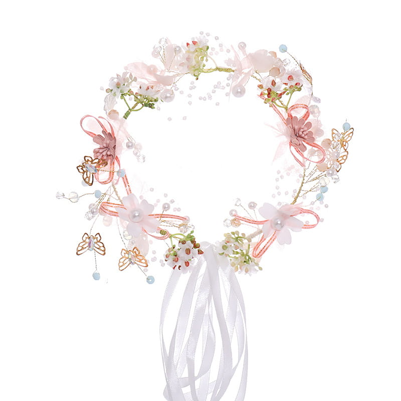 Luxury floral bridal wreath featuring delicate pink and white flowers adorned with sheer ribbons pearls and gold-toned butterfly accents, ideal for luxury women’s fashion occasions.