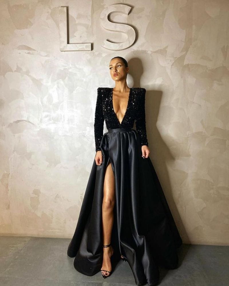 black sequined evening dress with polyester fiber satin skirt and high slit showcasing large posing temperament