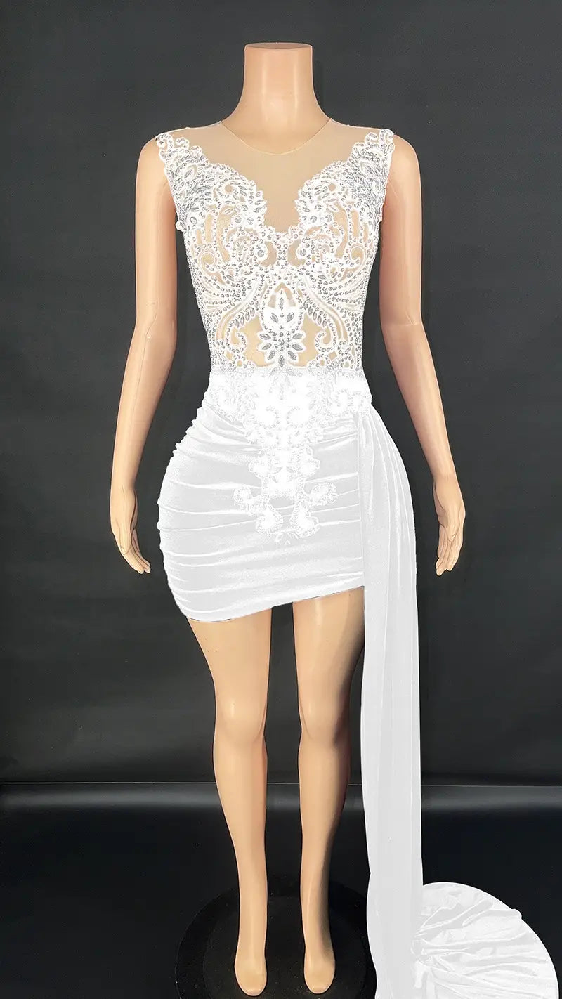 white lace and mesh mini dress with a side slit displayed as a summer luxury evening dress alternative to the black velvet luxury evening dress with side train
