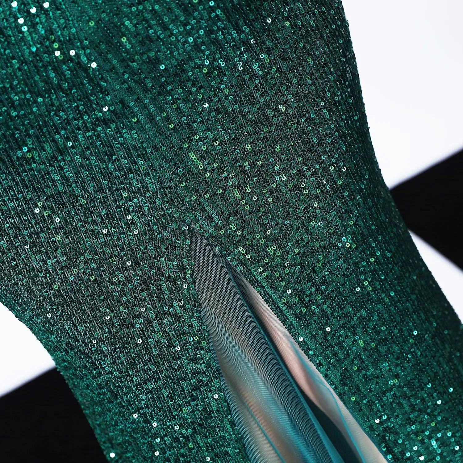 black sequined mermaid dress with long skirt length featuring emerald green sequined main fabric made of polyester fiber with sheer mesh lining