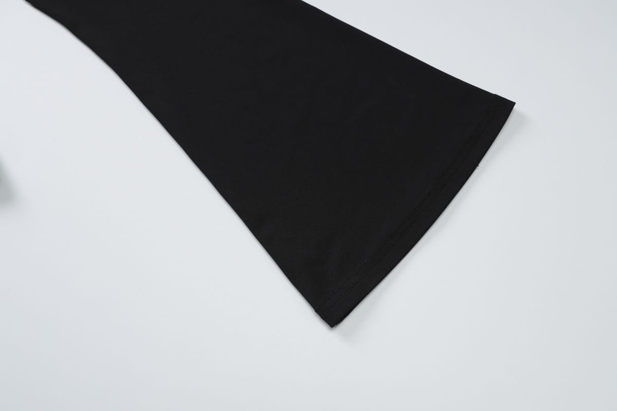 black fabric with a smooth matte finish of a sexy slim oblique shoulder floral mermaid dress showcasing its slim oblique shoulder design