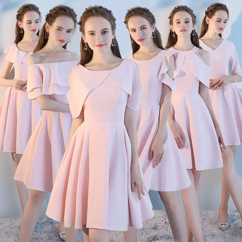 A soft pink short sisters off shoulder ruffled dress made from main fabric with a flared skirt and elegant shoulder detail.