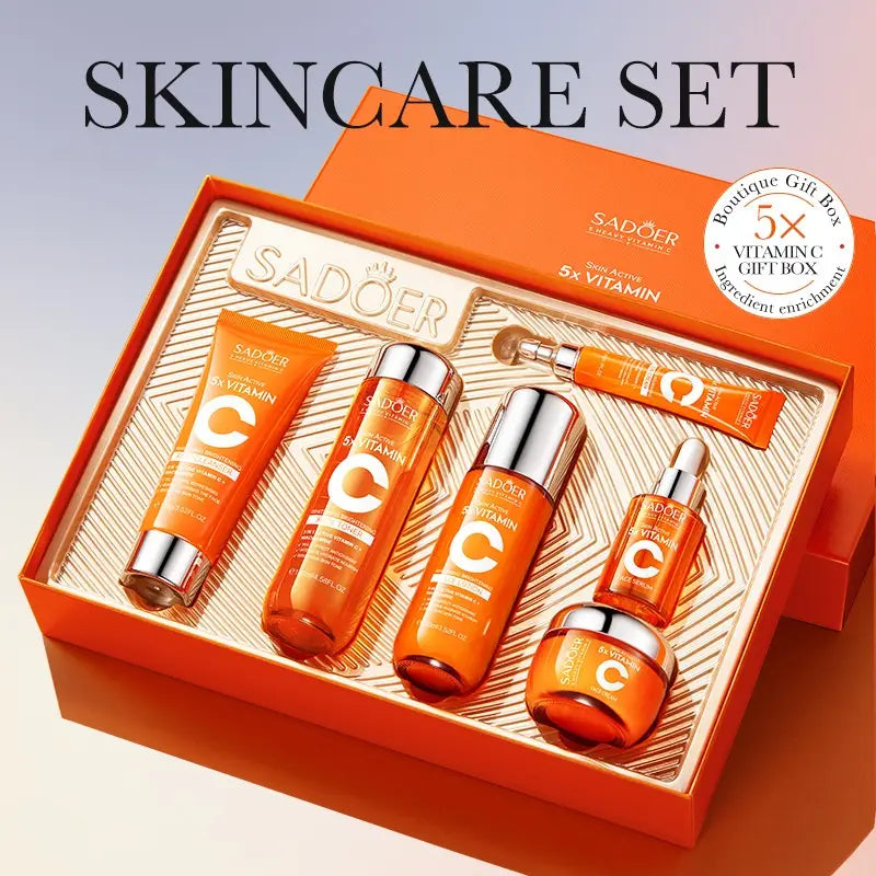 Vitamin C whitening skin care gift box featuring an orange sadoer skin care set with metallic silver caps in luxurious packaging for a premium skin care gift.