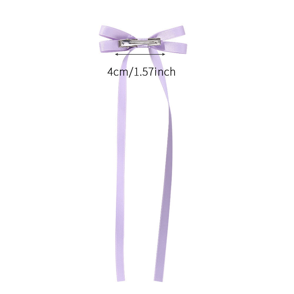 A delicate lavender satin bow braided hair clip with a silver metal clasp designed as a hair tie double accessory.