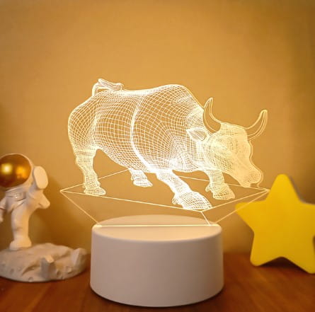 A white wireframe 3d illusion lamp shaped like a bull with colorful touch remote control and led lights for decorative lighting.