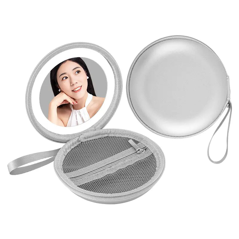 silver circular compact mirror with built-in led light and mesh storage compartment shown inside a blue and silver round bag mirror case designed for round bag blue storage and convenience