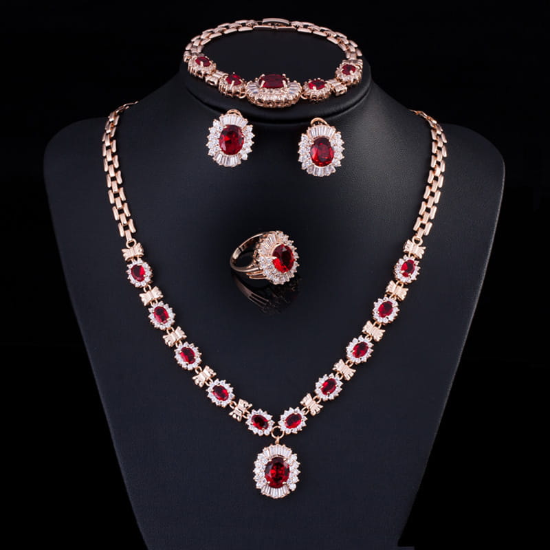 Elegant rose gold four-piece suit featuring vibrant red gemstones and sparkling white crystals from the big brand retro zircon jewelry set.