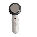 White handheld 3-in-1 ultrasonic massage facial device with black textured head and red power button using ultrasonic vibration technology