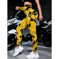 Bright yellow tie dye high waist seamless leggings with black splatter patterns made of stretchy athletic fabric for butt lift