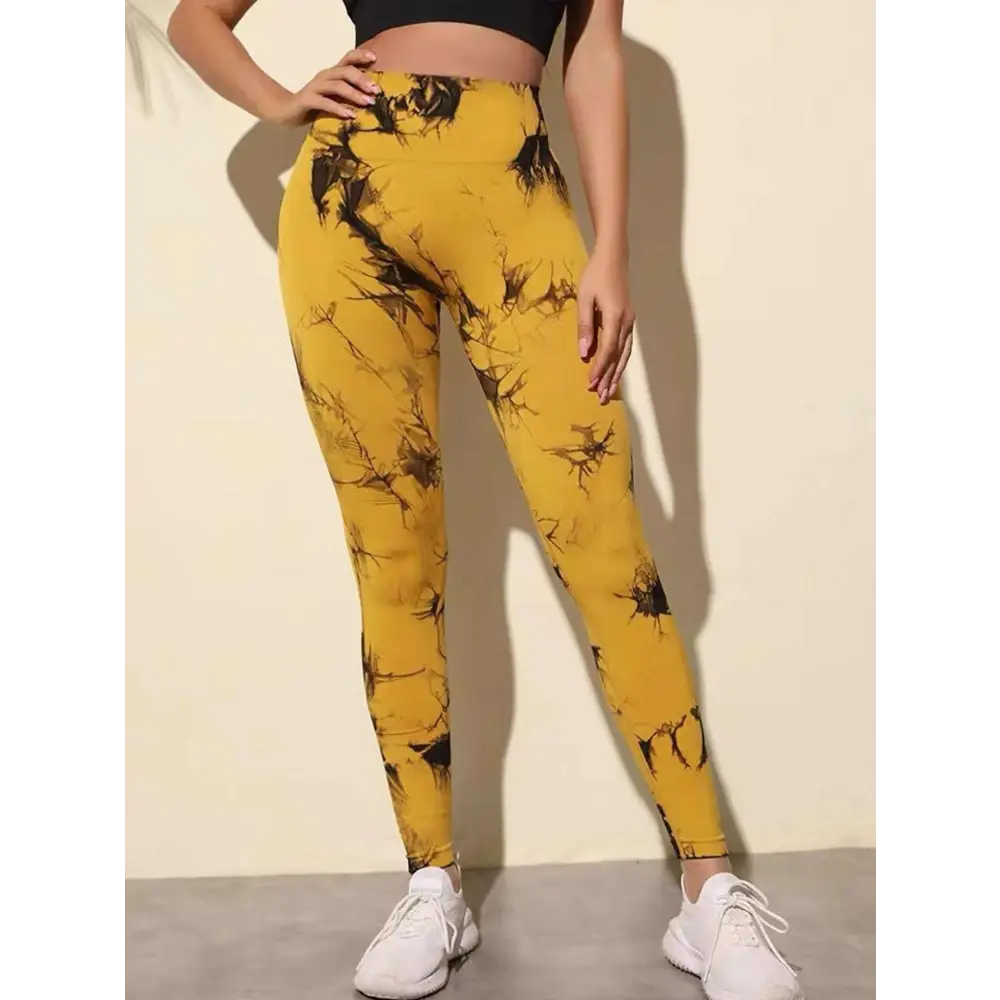 Yellow tie dye high waist seamless leggings with black abstract splatter design and butt lift feature