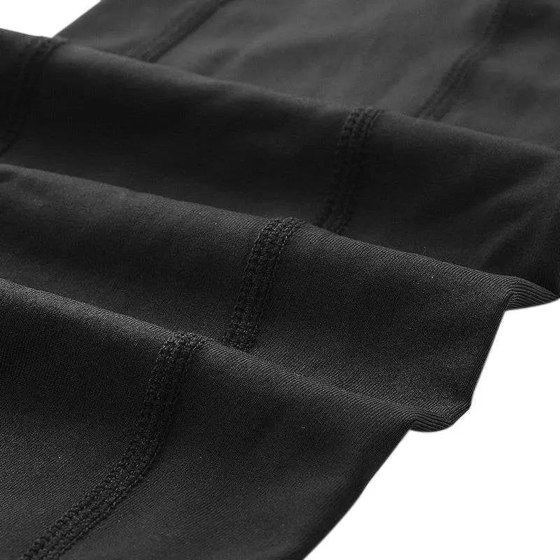 Black stretchy women compression skinny leggings with reinforced seams for fitness with pockets in a 3-pack set