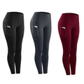 Three pairs of women compression skinny leggings in black dark gray and maroon with white trim side pockets for fitness
