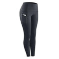 Black high-waisted women compression skinny leggings with sleek design and side pockets for fitness use