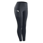 Black high-waisted women compression skinny leggings with sleek design and side pockets for fitness use