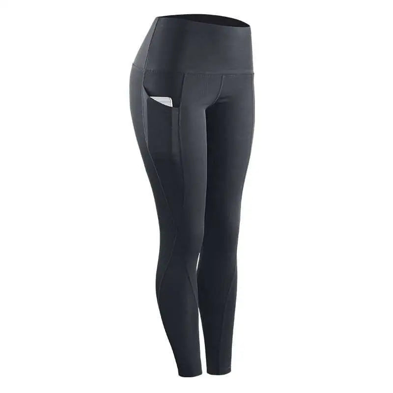 Black high-waisted women compression skinny leggings with sleek design and side pockets for fitness use