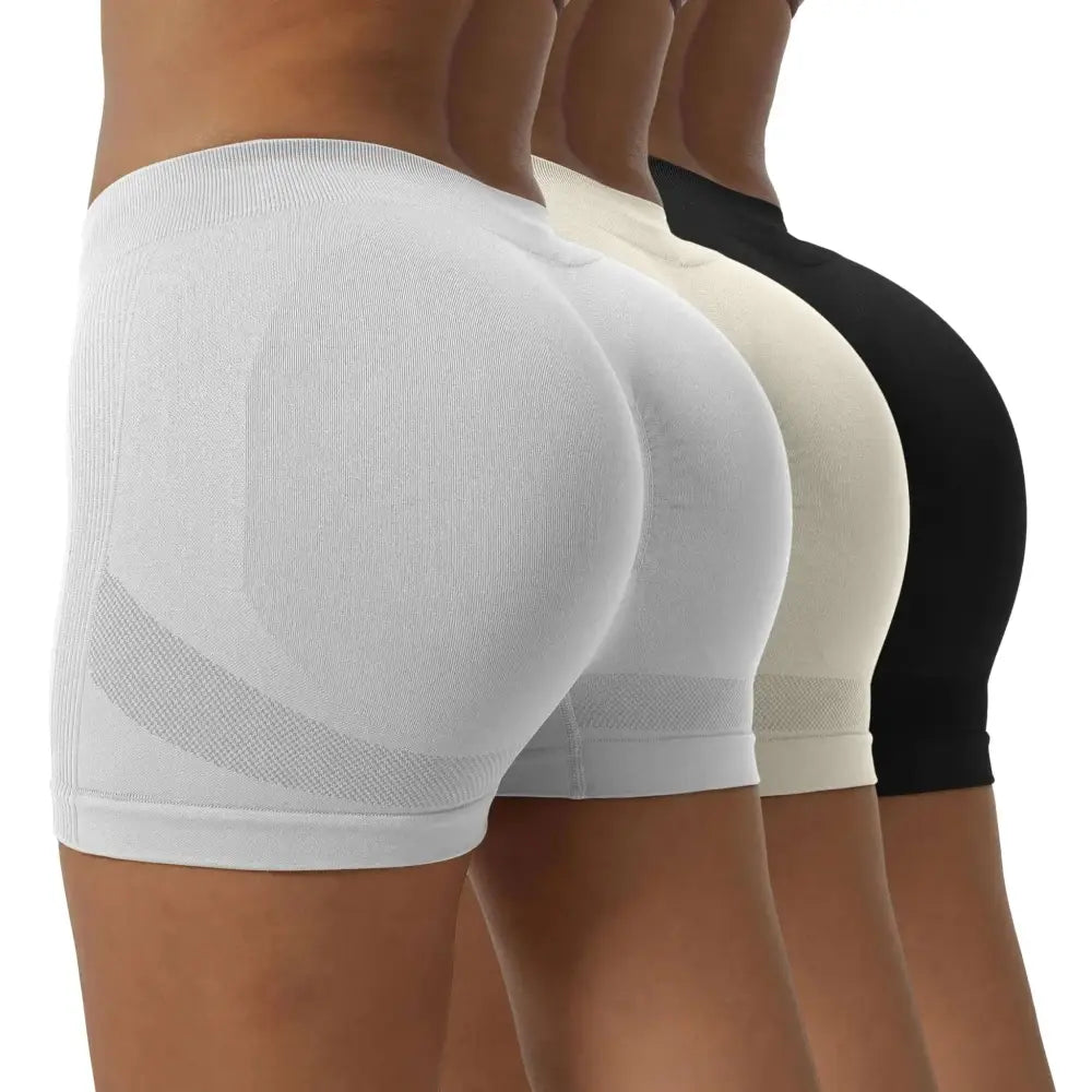 White seamless yoga shorts with ribbed texture mesh panels and scrunch butt lifting design shown with size chart