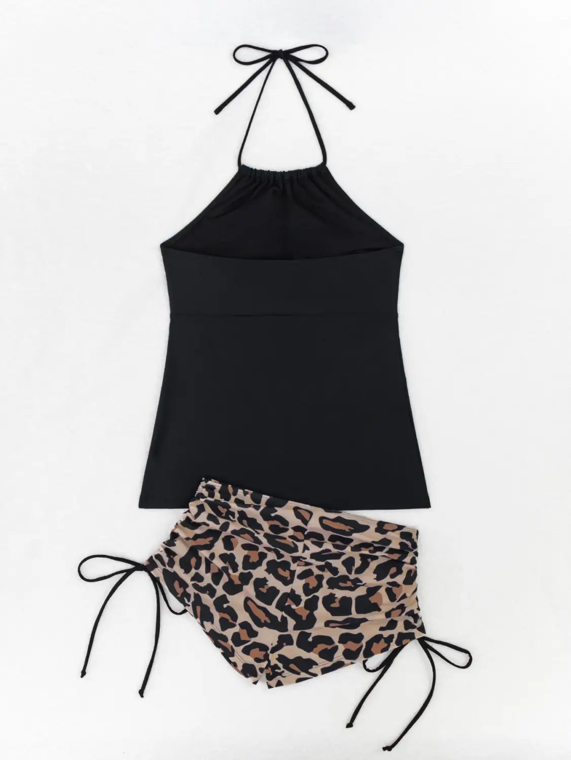 black halterneck printed halter bikini top paired with leopard print shorts as part of a floral halterneck printed halter split swimsuit ensemble