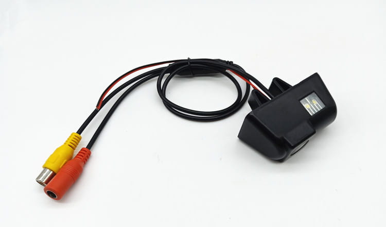 black plastic rearview camera with coiled black cable and yellow and red rca connectors shown from the back side for hd night vision reversing and vision reversing rear applications.