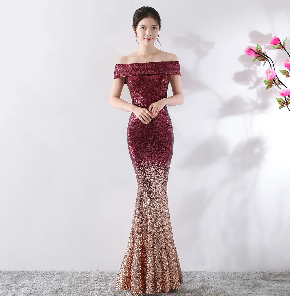 A shimmering off-the-shoulder mermaid birthday party dress featuring a gradient of deep burgundy to rose gold sequins designed as a slimming host gown.