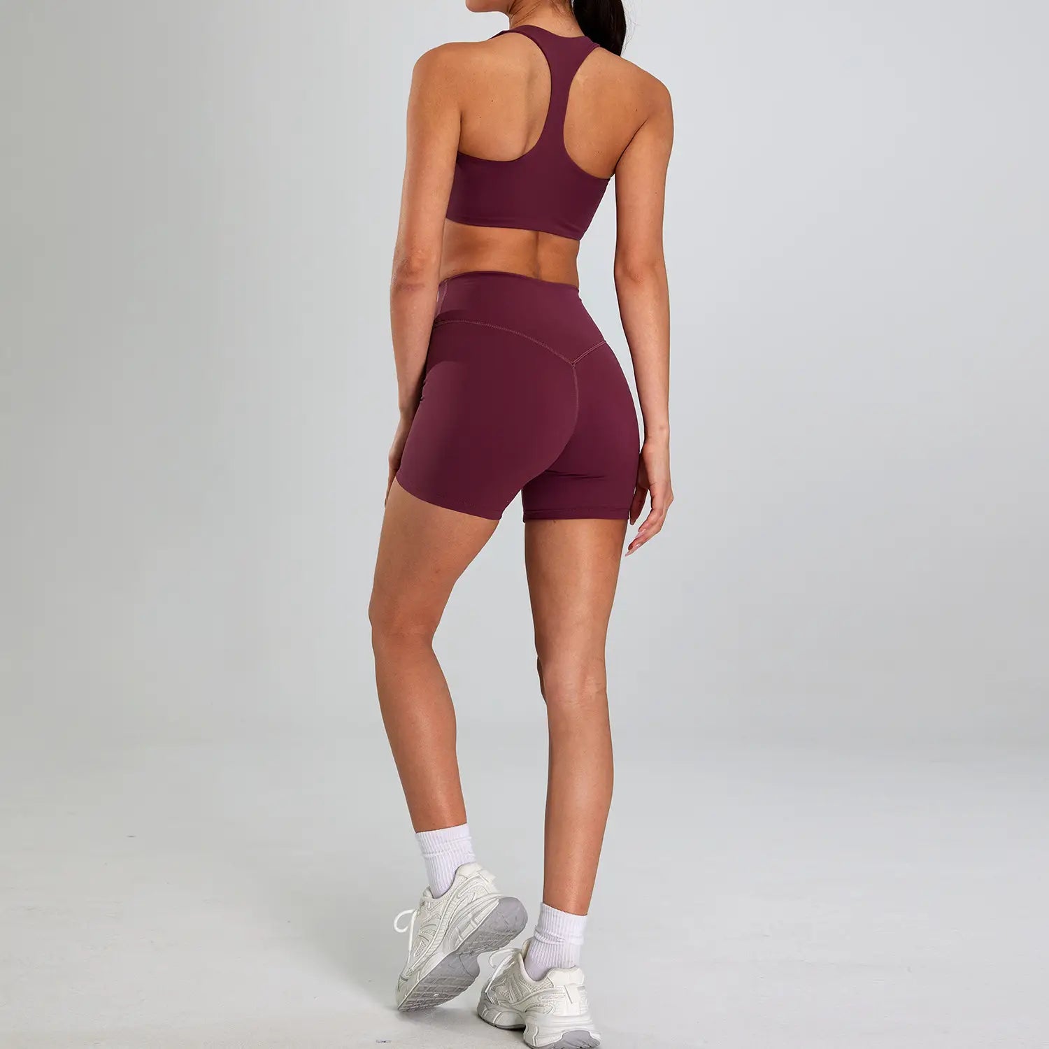 Maroon high-waisted seamless athletic shorts with a form-fitting design for a sports suit outdoor running nude set.
