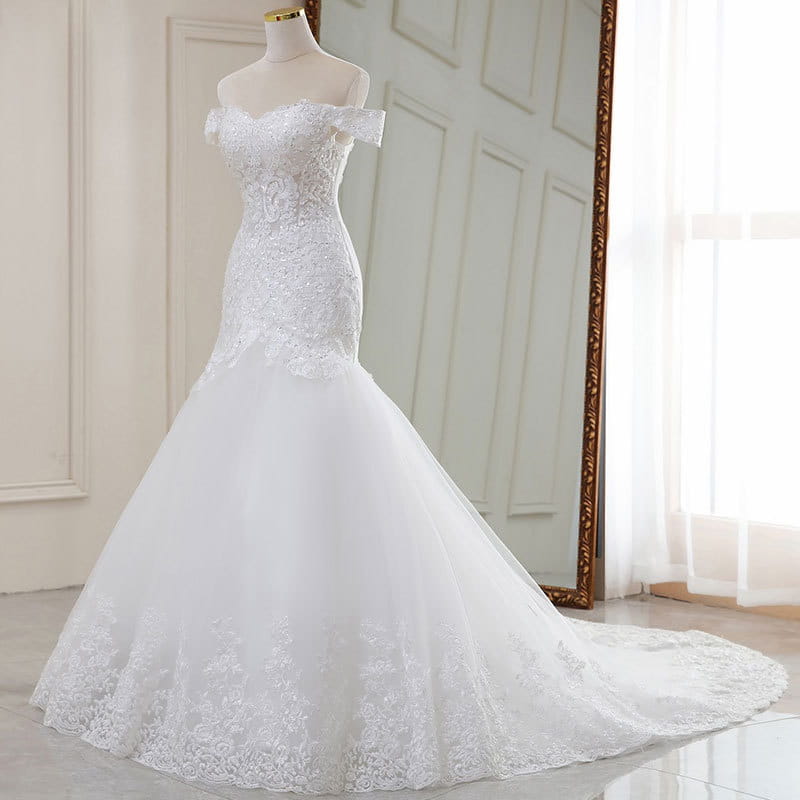 high waist white lace mermaid wedding dress made of polyvinyl alcohol fiber featuring a white off-the-shoulder design with intricate lace detailing and a flowing tulle skirt.